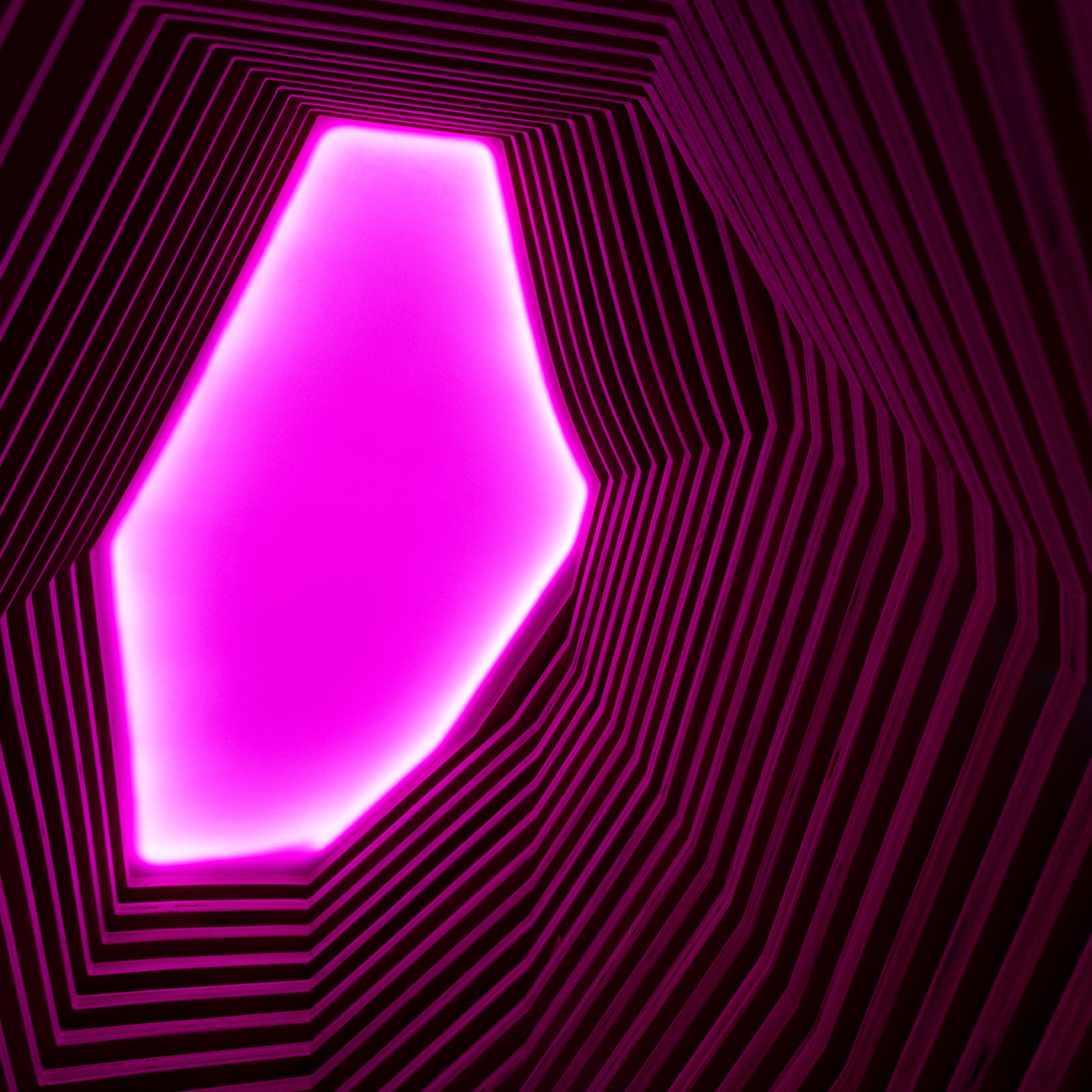 View up through skylight with pink lighting