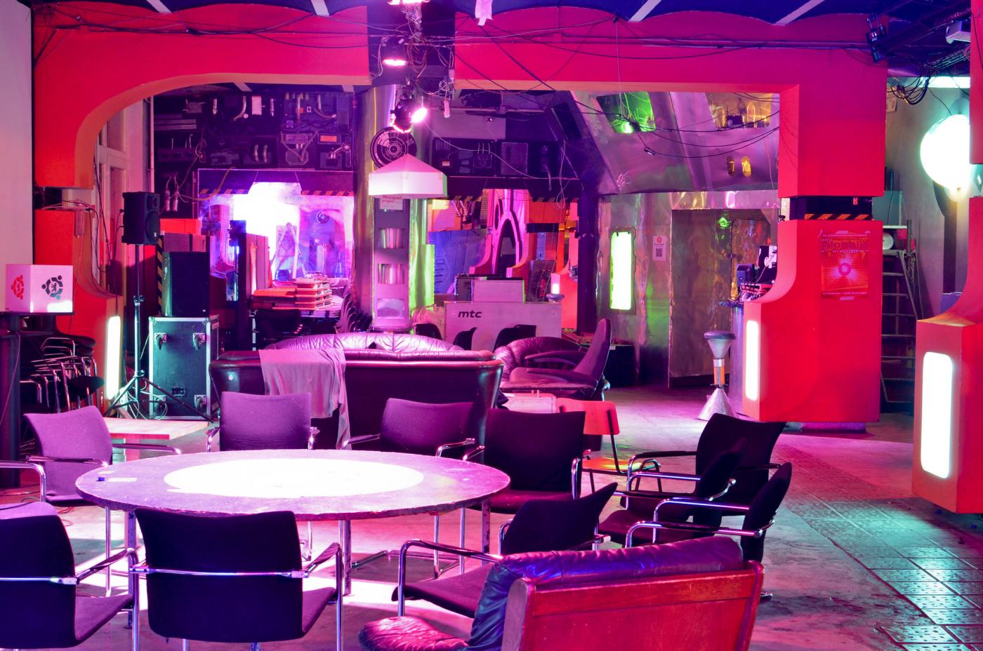 interior of futuristic spaceship themed space with table and chairs