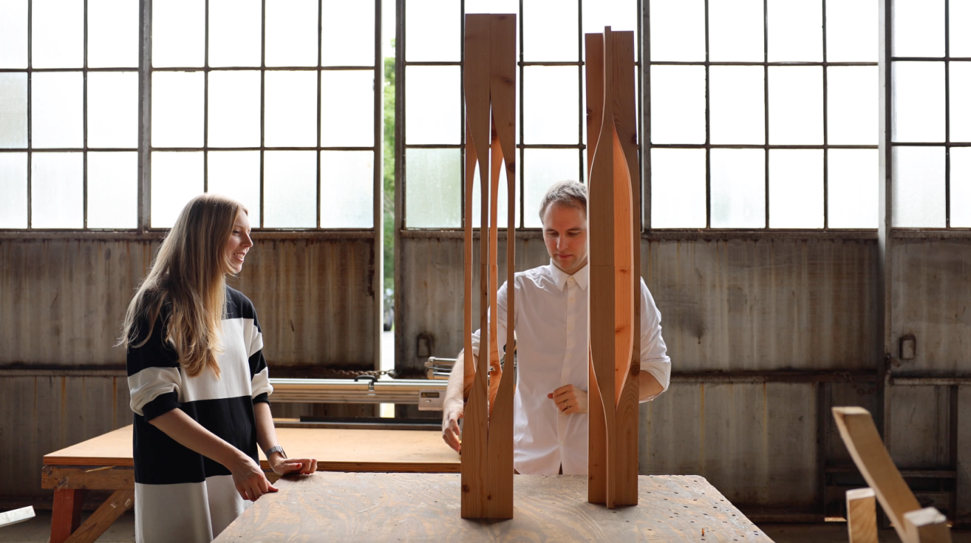 Two professors in a woodshop with fabricated wood columns